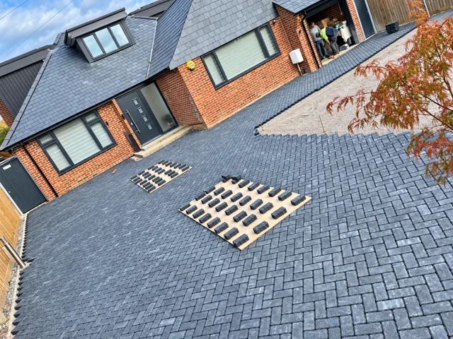 Herringbone paving progressing across the front of the house